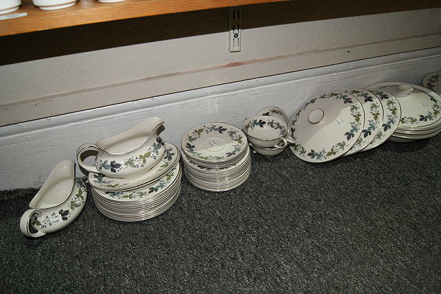 Appraisal: A ROYAL DOULTON BURGUNDY DINNER SERVICE and a breakfast set