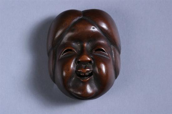 Appraisal: JAPANESE BOXWOOD NETSUKE Meiji period Carved to depict a mask