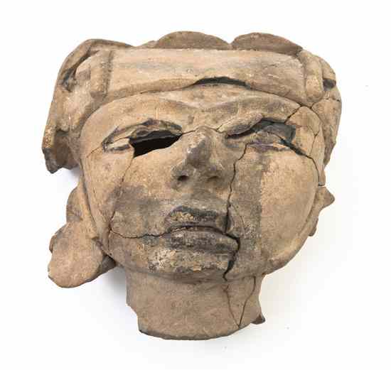 Appraisal: An Olmec Style Pottery Mask with helmet previously broken and