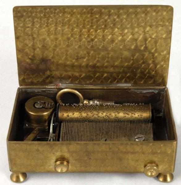 Appraisal: Small Brass Key-Wind Music Box Description Plays well - long