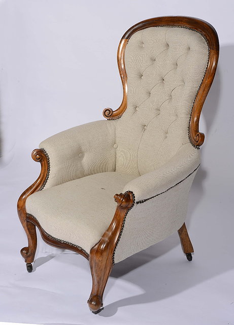 Appraisal: A Victorian mahogany framed armchairwith button upholstery