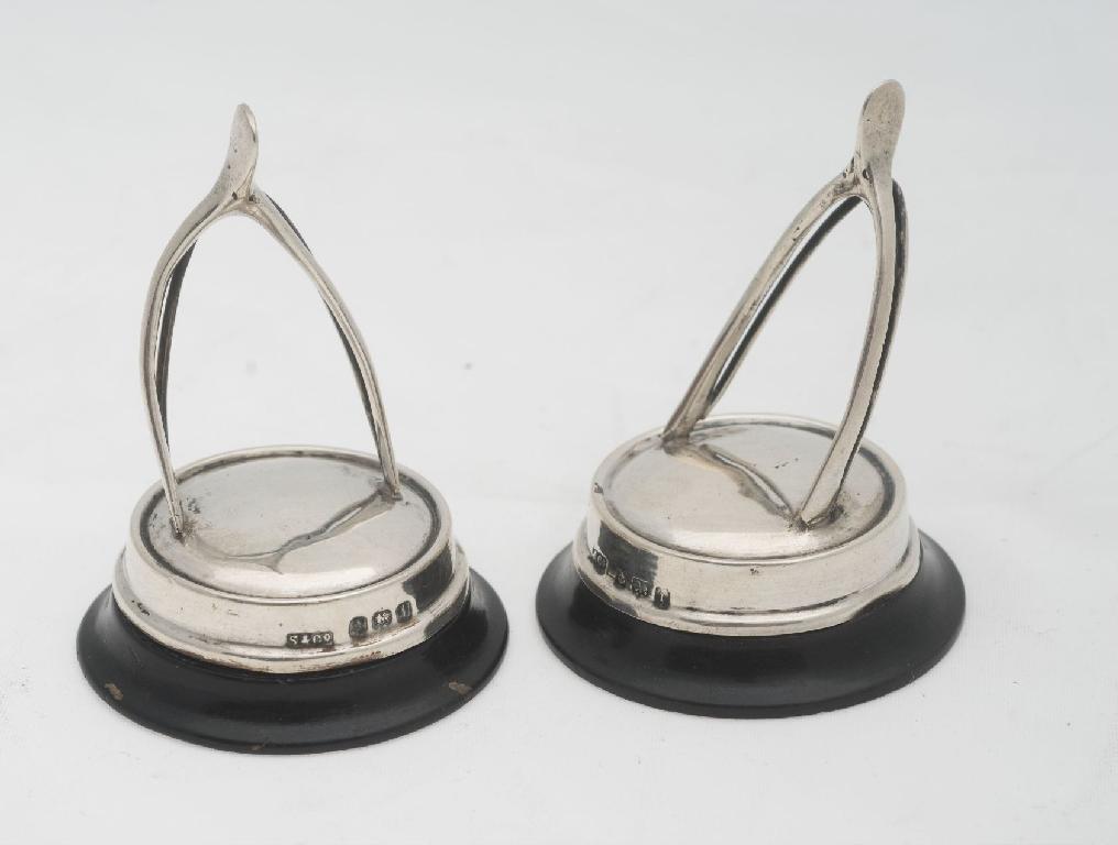 Appraisal: PAIR OF EDWARDIAN SILVER MENU HOLDERS BIRMINGHAM of wishbone form