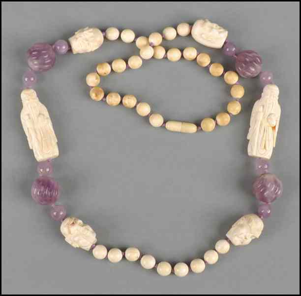 Appraisal: CARVED IVORY AND AMETHYST NECKLACE Length '' Condition No Specific