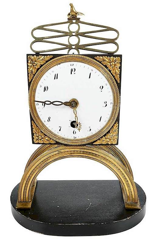 Appraisal: Gilt Brass Skeleton Clock Continental th century white enamel dial