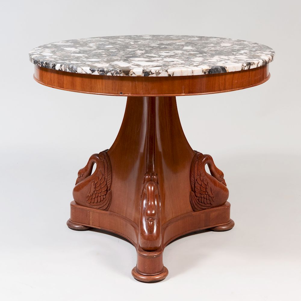 Appraisal: Empire Style Carved Mahogany Center Table Fitted with a marble