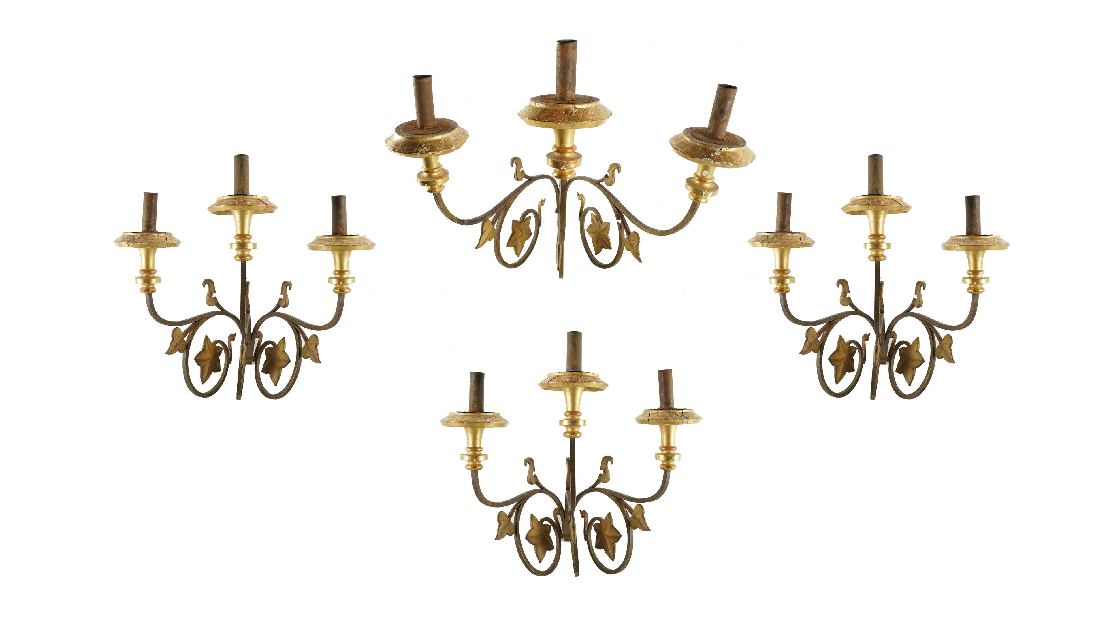 Appraisal: FOUR THREE-LIGHT WALL SCONCES gilt-painted iron and wood Condition with