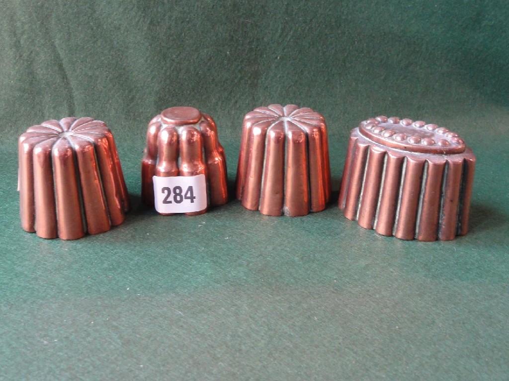 Appraisal: A collection of four various miniature copper jelly moulds