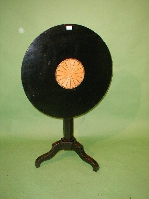 Appraisal: A thC ebonised tripod table with shell inlaid top