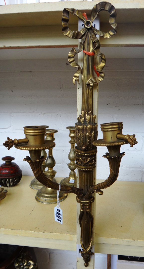 Appraisal: A pair of French gilt bronze twin light wall appliques