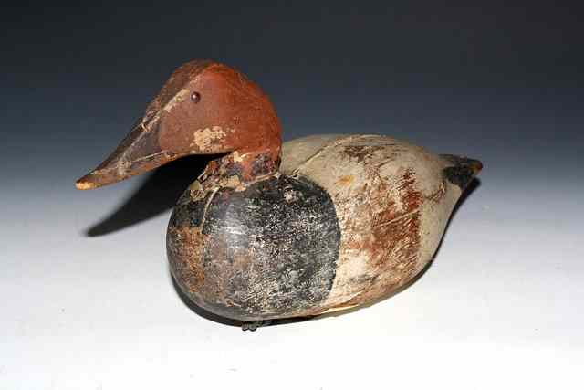 Appraisal: AN AMERICAN PAINTED WOOD POCHARD DECOY DUCK with metal hanger