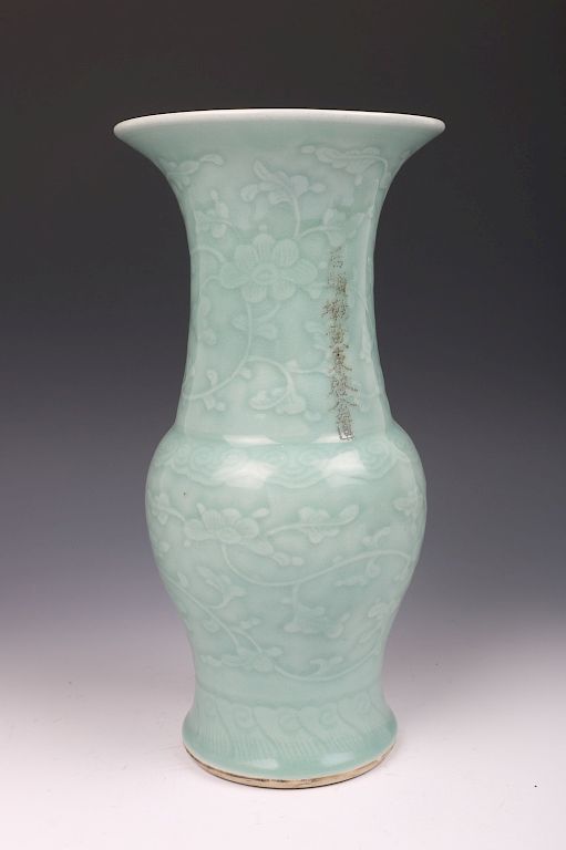 Appraisal: CHINESE INCISED CELADON VASE DRILLED The rounded body rising from