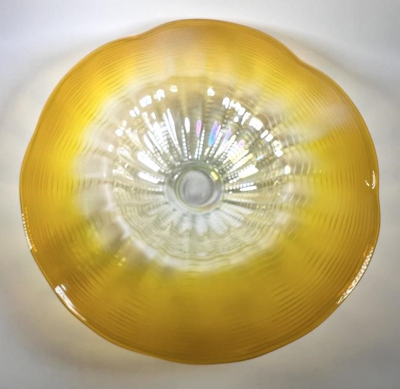 Appraisal: Hand blown art glass bowl iridescent yellow with circular pattern