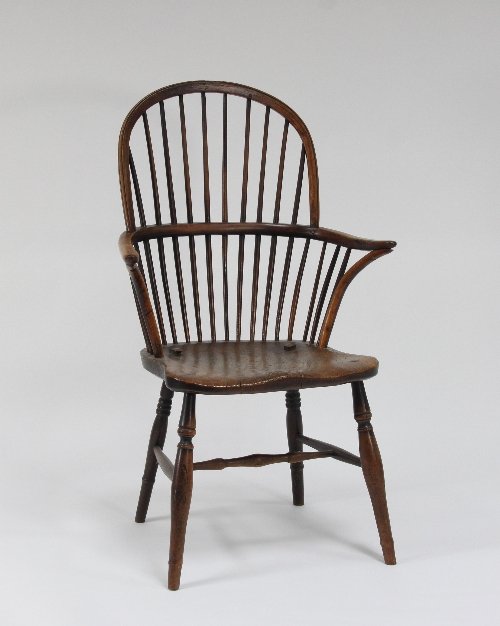 Appraisal: A yew wood and elm stick back Windsor chair