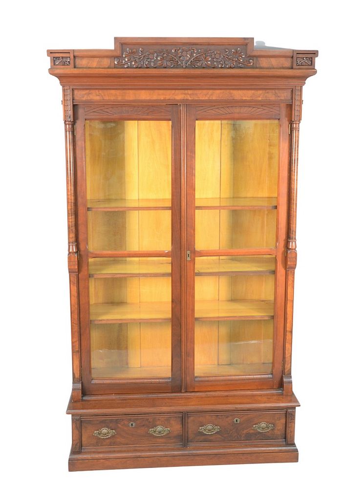 Appraisal: Victorian Walnut and Burl Walnut Carved Bookcase with two doors