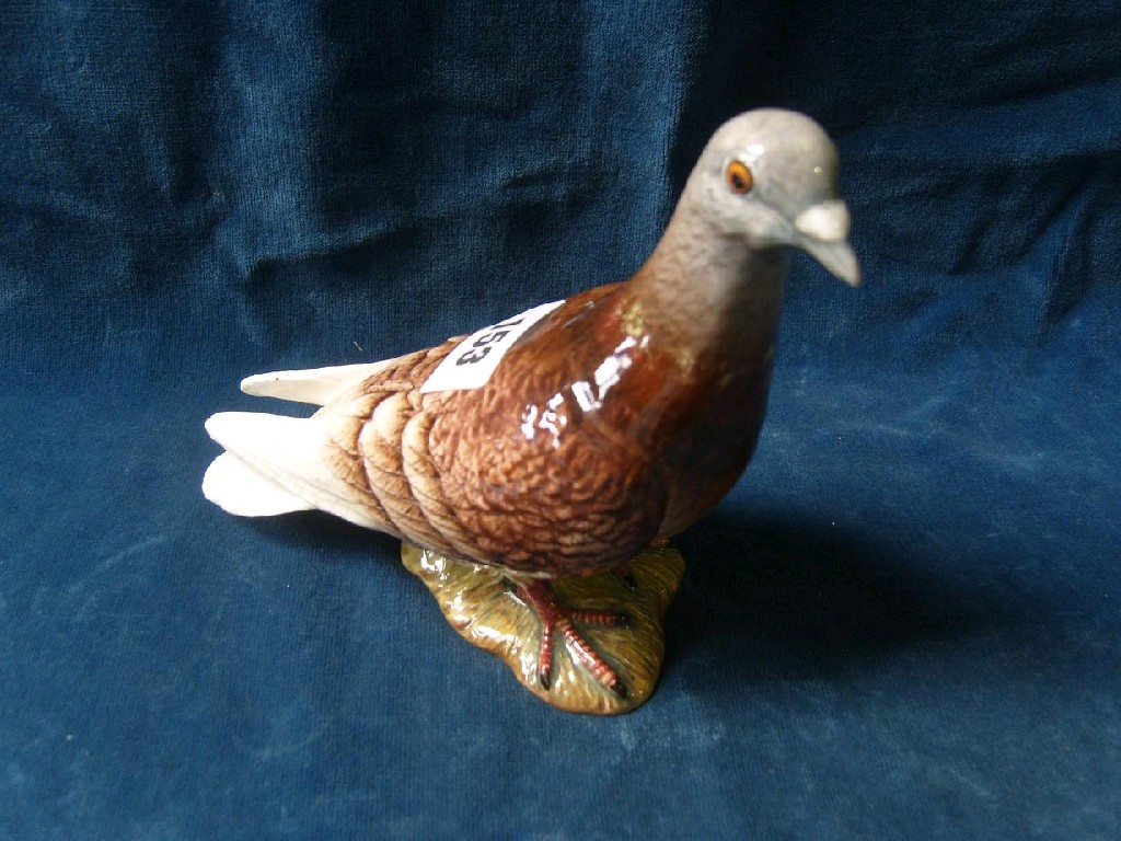 Appraisal: A Beswick figure of a racing pigeon