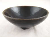 Appraisal: A Chinese tea bowl the dark brown body covered in