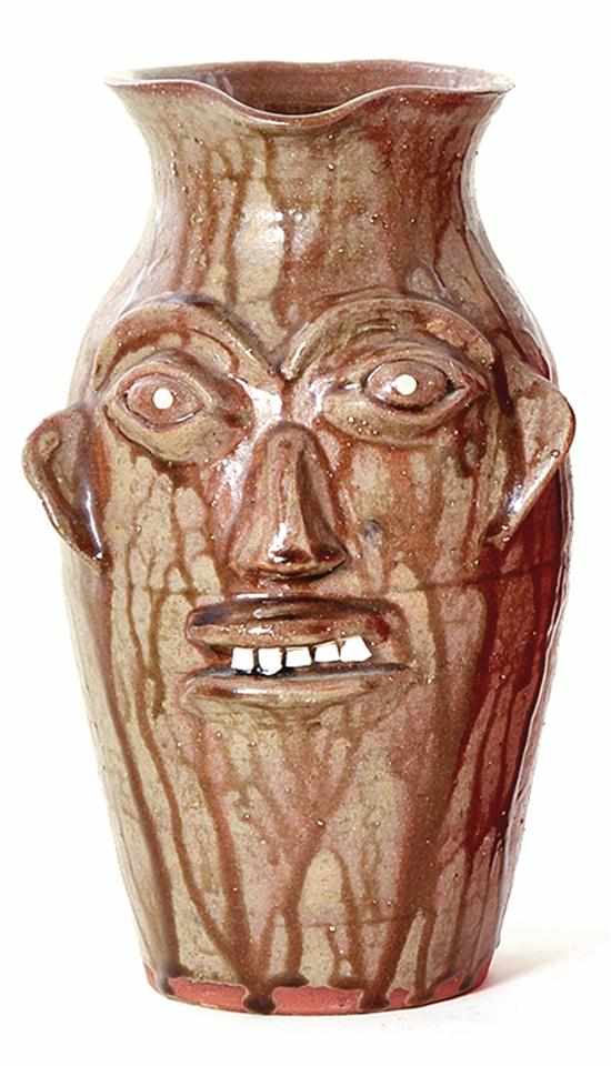 Appraisal: Walter Fleming stoneware face pitcher North Carolina drippy alkaline glaze