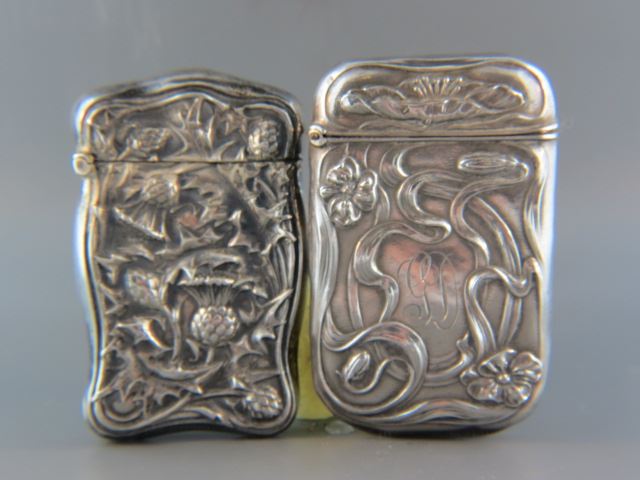 Appraisal: Sterling Silver Match Safes thistle and water lily designs X