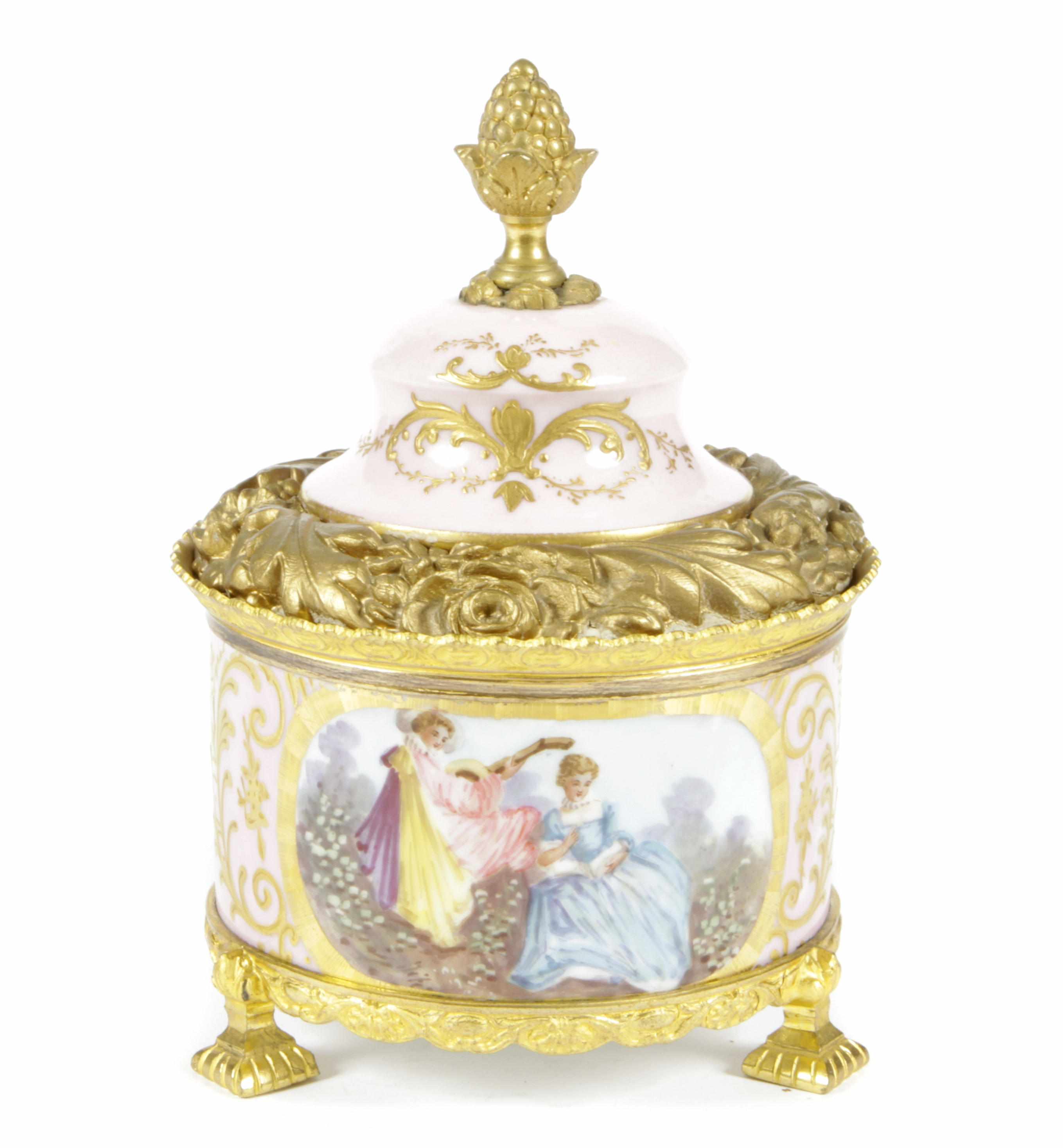 Appraisal: A French gilt bronze mounted pink porcelain cylidrical covered box