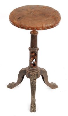 Appraisal: A cast iron artist's adjustable stool the revolving circular leather