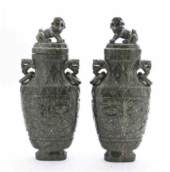 Appraisal: A Pair of Carved Hardstone Lidded Vessels of a mottled