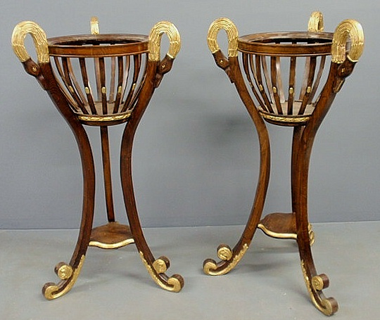 Appraisal: Pair of reproduction faux mahogany plant stands with gilt swan