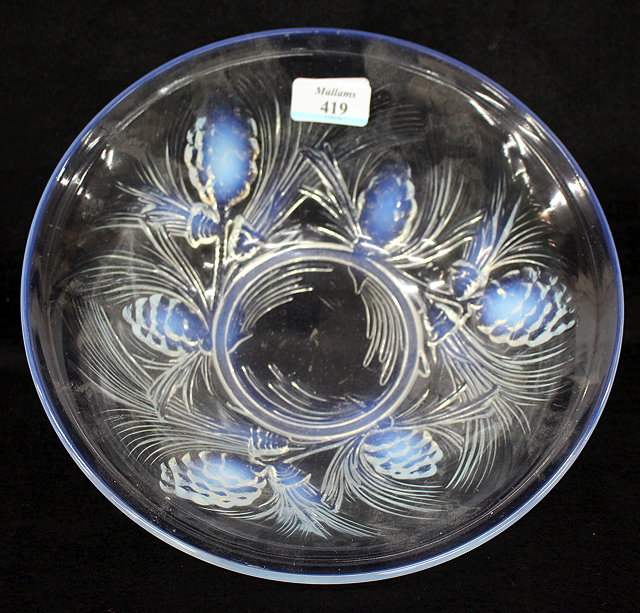 Appraisal: A LALIQUE STYLE MOULDED OPAQUE GLASS BOWL decorated with fir