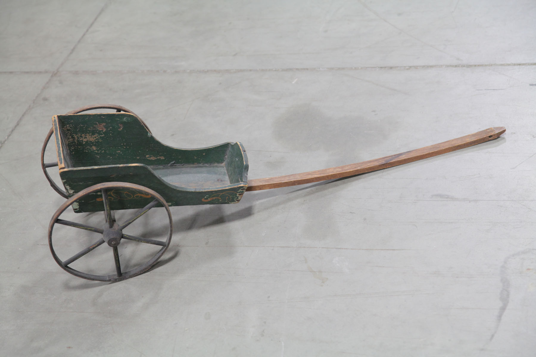 Appraisal: CHILD'S PULL CART American early th century Green painted wooden