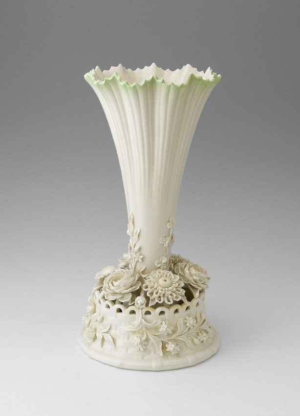 Appraisal: IRISH BELLEEK PORCELAIN FLORAL TRUMPET VASE Flared rim with applied