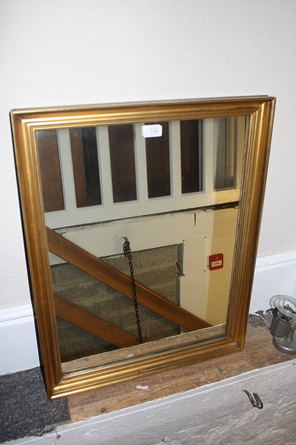 Appraisal: A GILT RECTANGULAR WALL MIRROR cm x cm