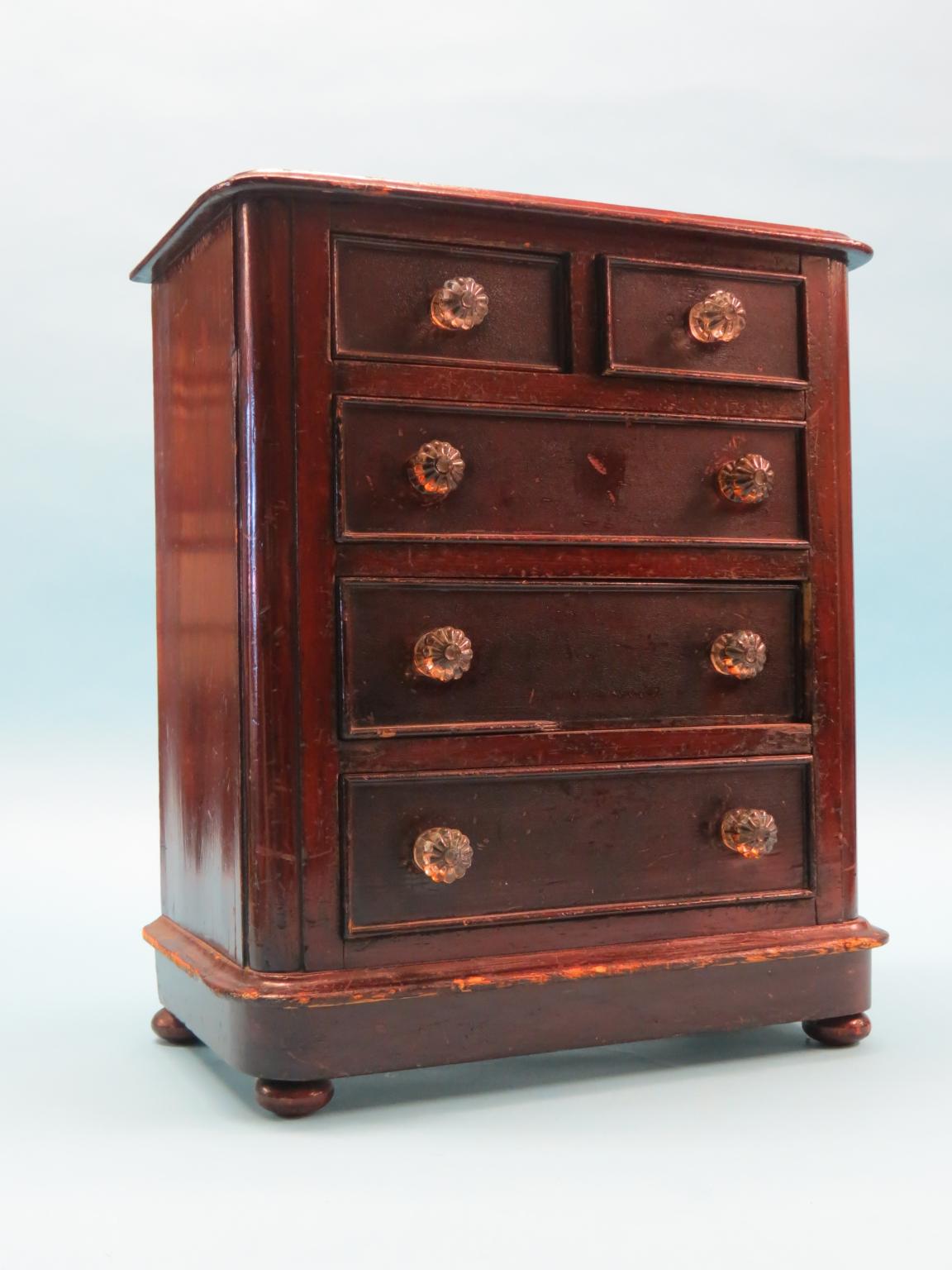 Appraisal: A Victorian miniature chest dark-stained pine two short and three