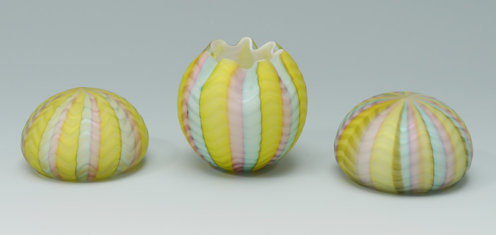 Appraisal: RAINBOW HERRINGBONE SATIN GLASS PAPERWEIGHTS AND ROSE BOWL Two paperweights