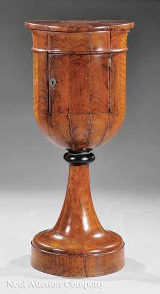 Appraisal: A Biedermeier Inlaid Mahogany Urn-Form Commode c segmented top centered