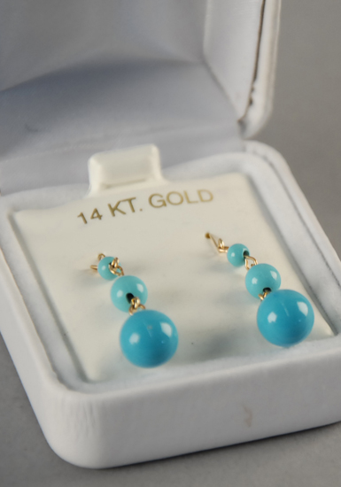 Appraisal: Gold and Turquoise Bead Earrings with three graduated beads on