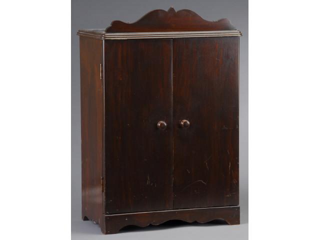 Appraisal: Doll-Size Wardrobe America mid th century Dark stained plywood H