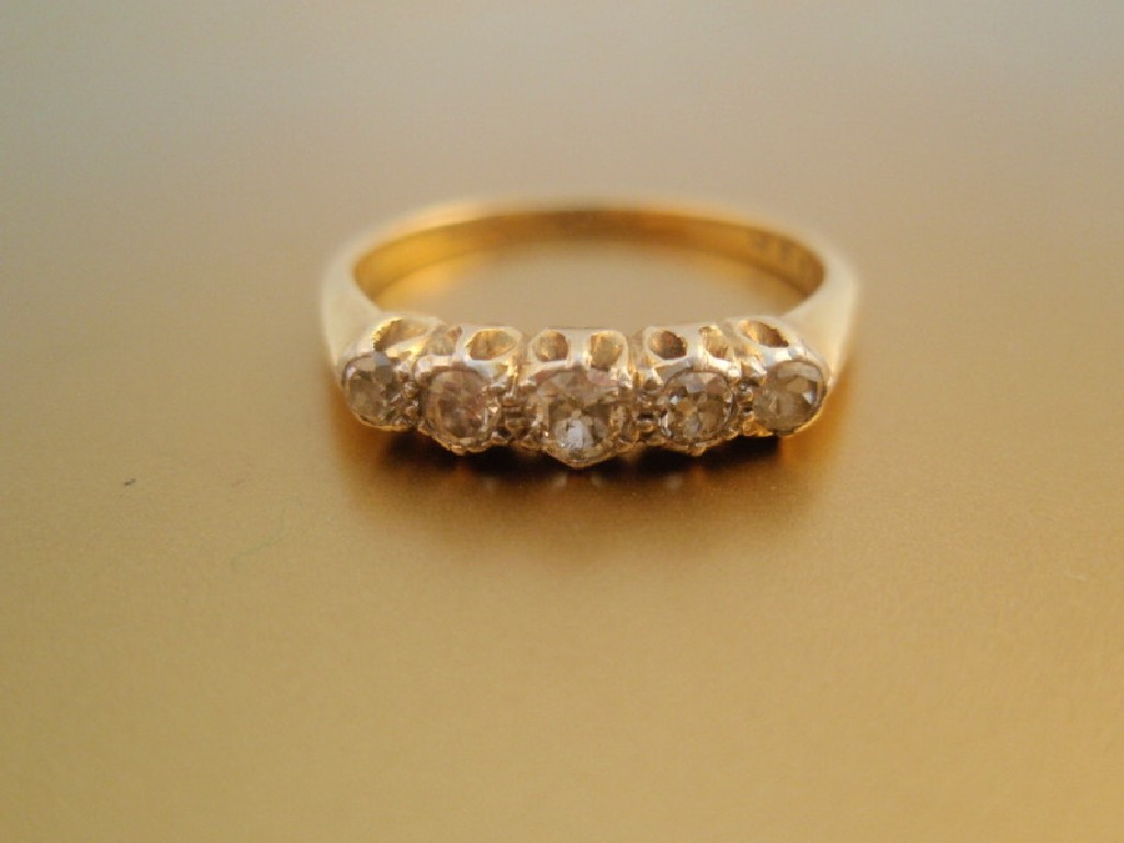 Appraisal: A five stone in line diamond set ring shank stamped