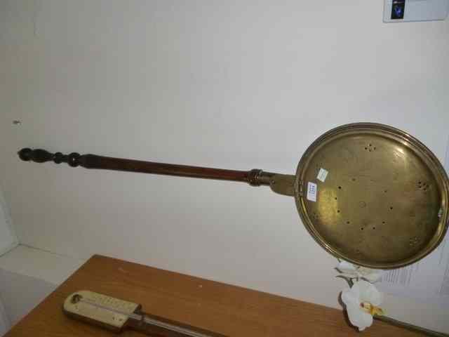 Appraisal: AN ANTIQUE BRASS BED WARMING PAN with turned fruitwood handle