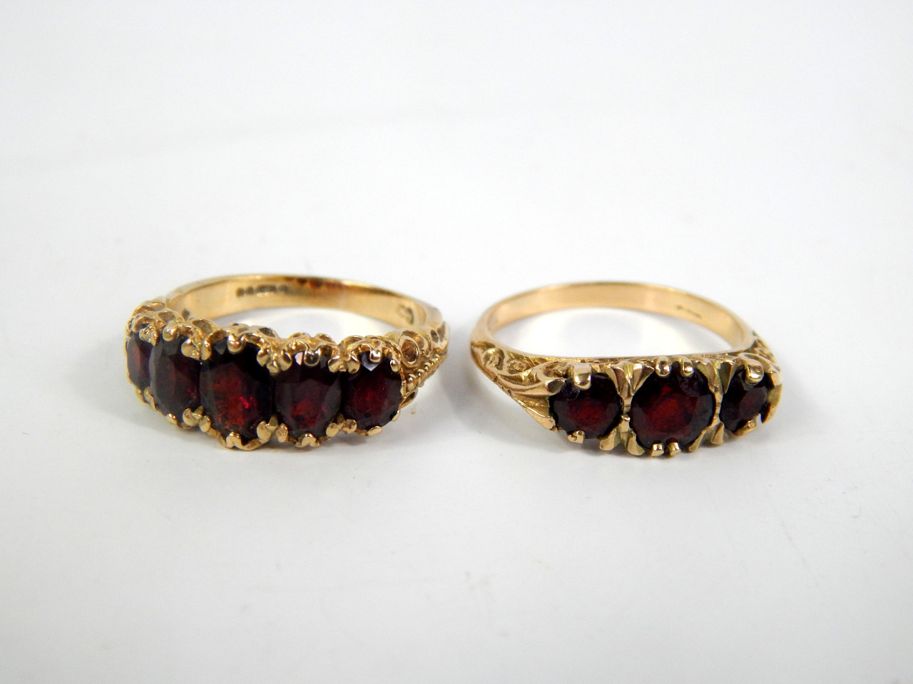 Appraisal: A ct gold and garnet five stone ring and a