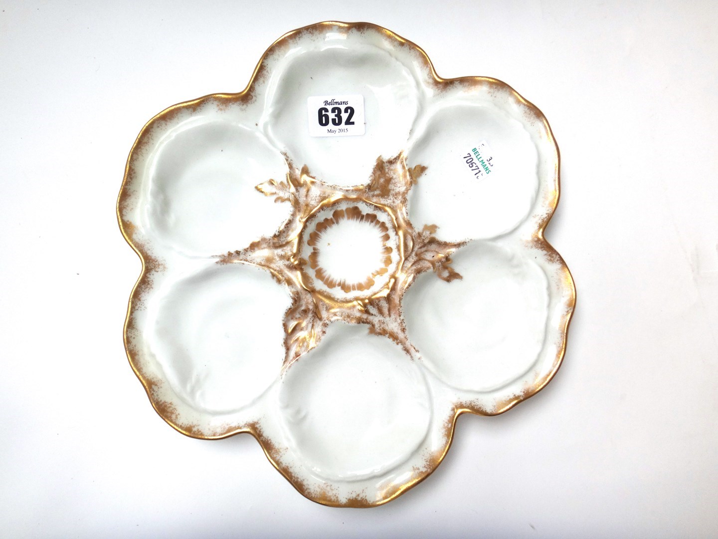 Appraisal: A set of eleven Limoges porcelain oyster dishes each moulded