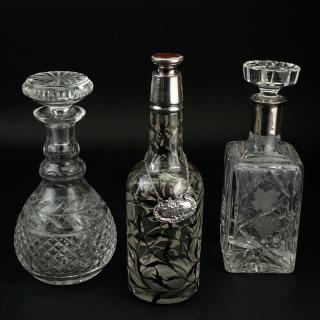 Appraisal: Grouping of Three Decanters Includes two etched crystal and one