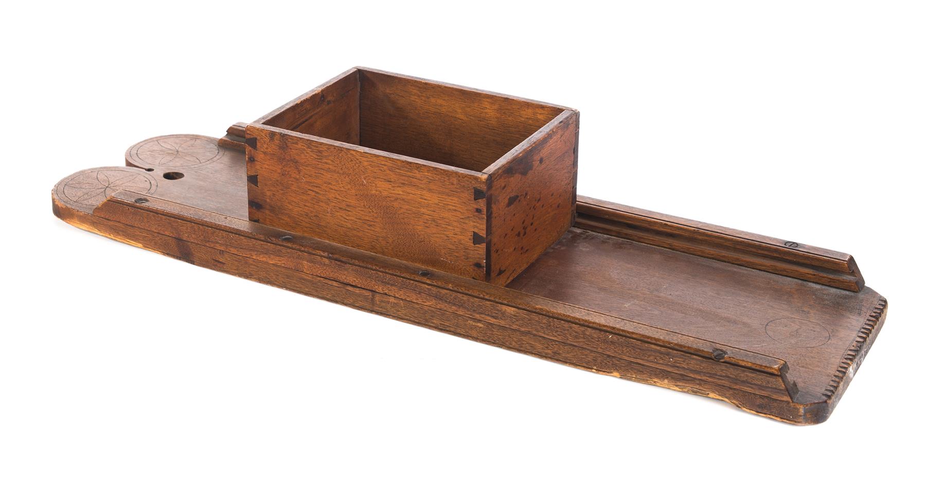 Appraisal: AMERICAN KRAUT CUTTER Mid th century walnut Dovetailed box on