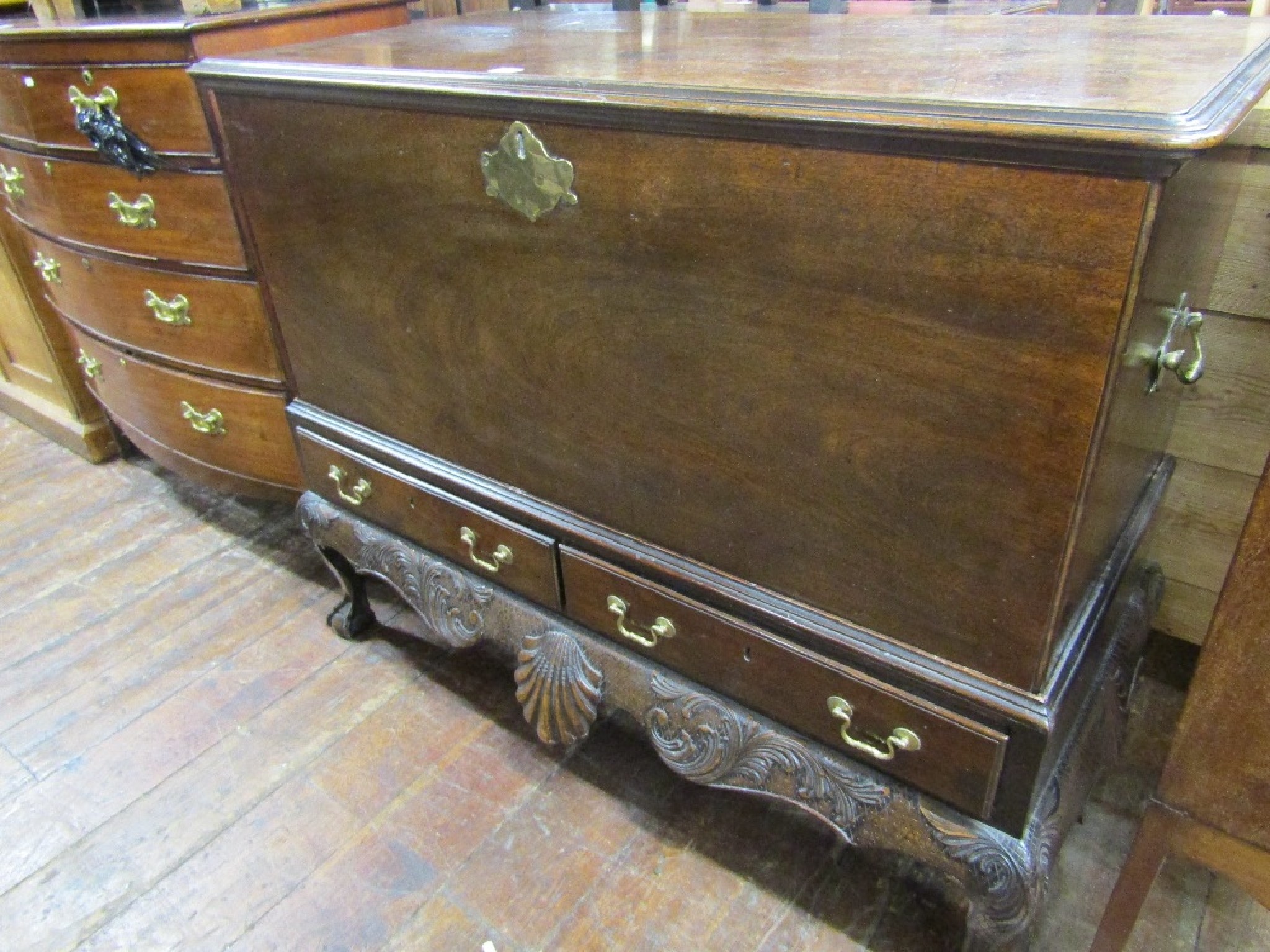 Appraisal: A Georgian mahogany silver chest on stand the rising lid