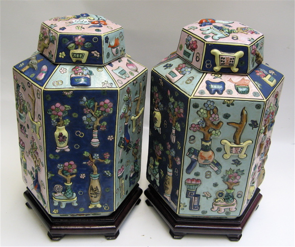 Appraisal: PAIR OF CHINESE HEXAGONAL COVERED GINGER JARS with tri-color panels