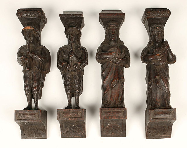 Appraisal: A SET OF FOUR CARVED WOODEN MOUNTS in the form