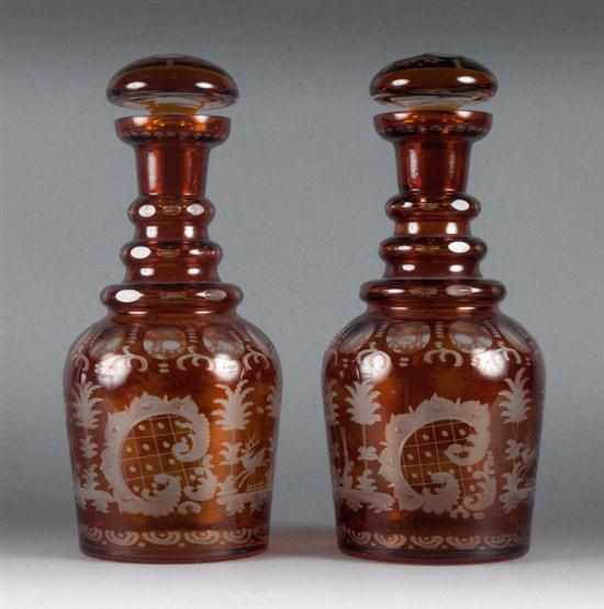 Appraisal: Pair of Bohemian amber etched cut-to-clear glass decanters th century