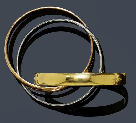 Appraisal: A GOLD BANGLE CARTIER TRINITY Yellow white and pink gold