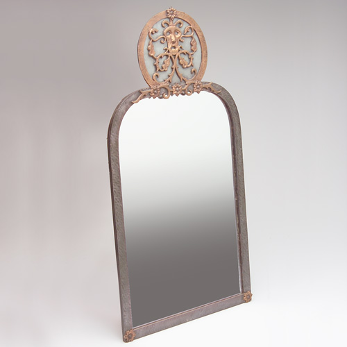 Appraisal: OSCAR BACH Wall-hanging mirror with floral motif topped by a