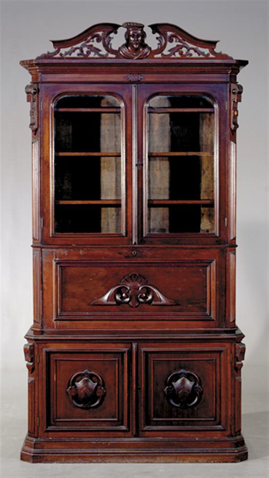 Appraisal: American Victorian carved walnut secretary bookcase circa top section with