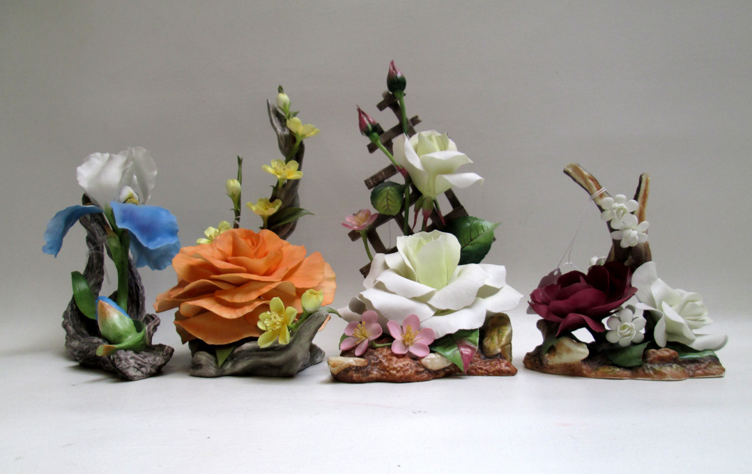 Appraisal: FOUR BOEHM FINE PORCELAIN SCULPTURES Miss Indiana Iris Pascali Rose