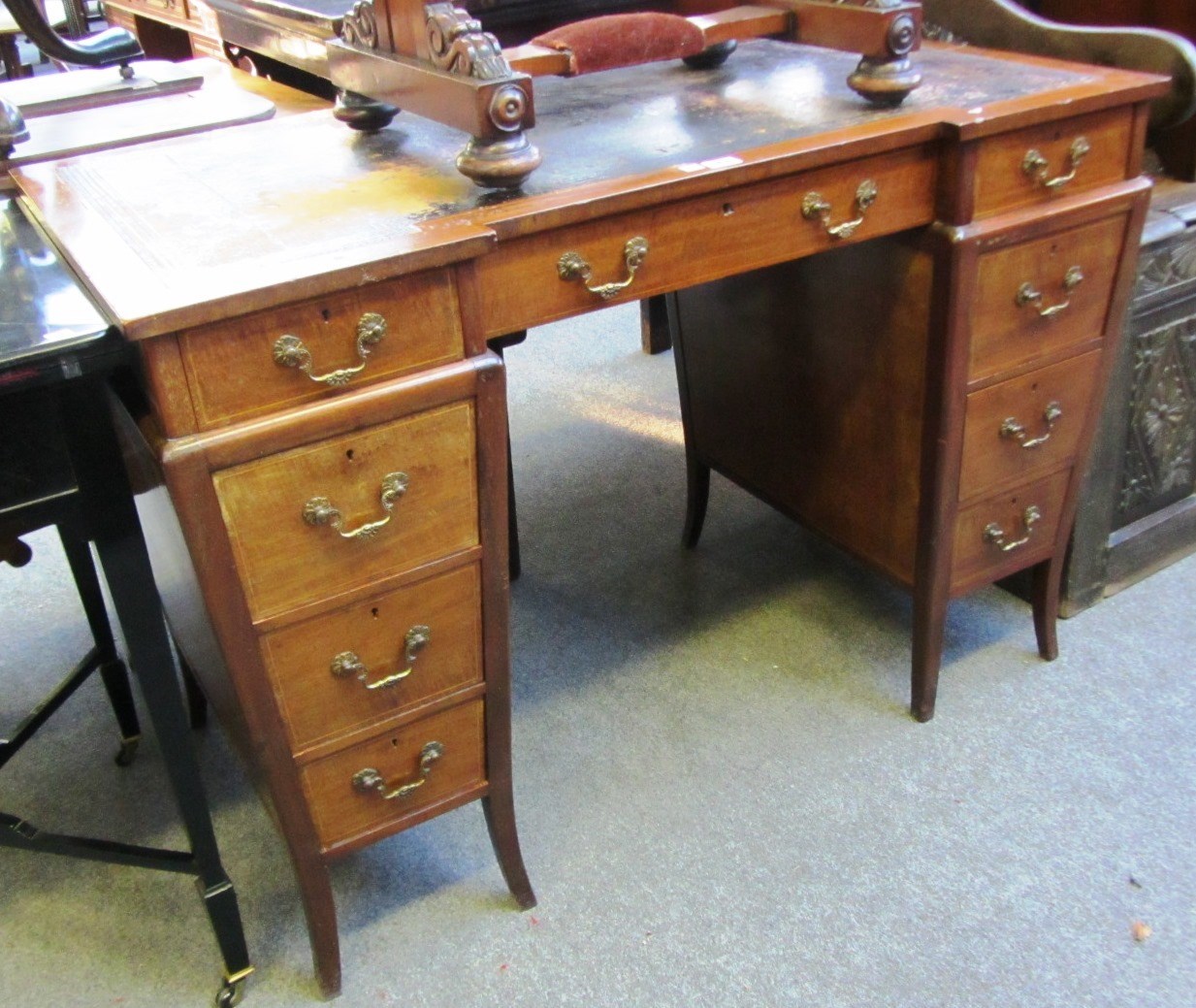 Appraisal: A late th century inlaid mahogany inverted breakfront pedestal desk